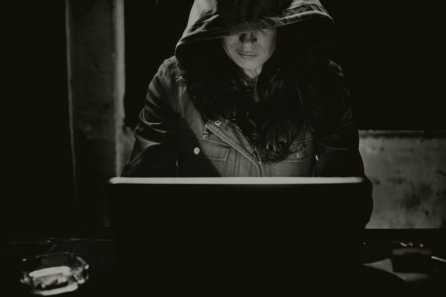 cyber scammer woman hacking computer